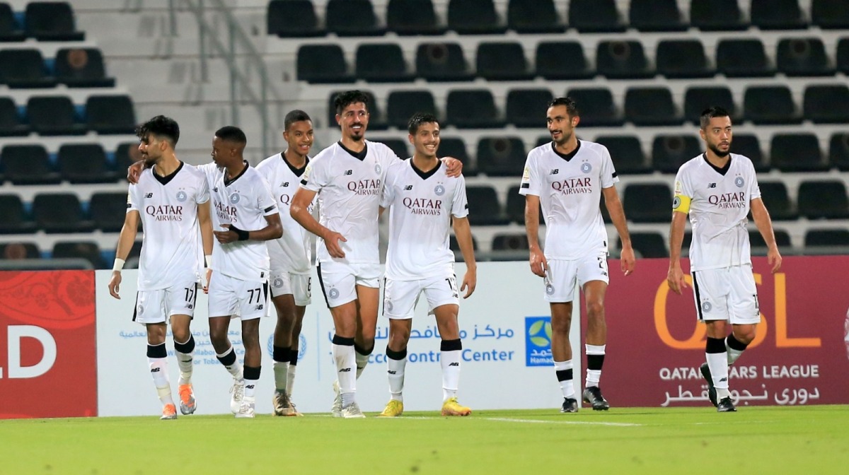 Al Sadd players celebrate after defeating Al Wakrah.