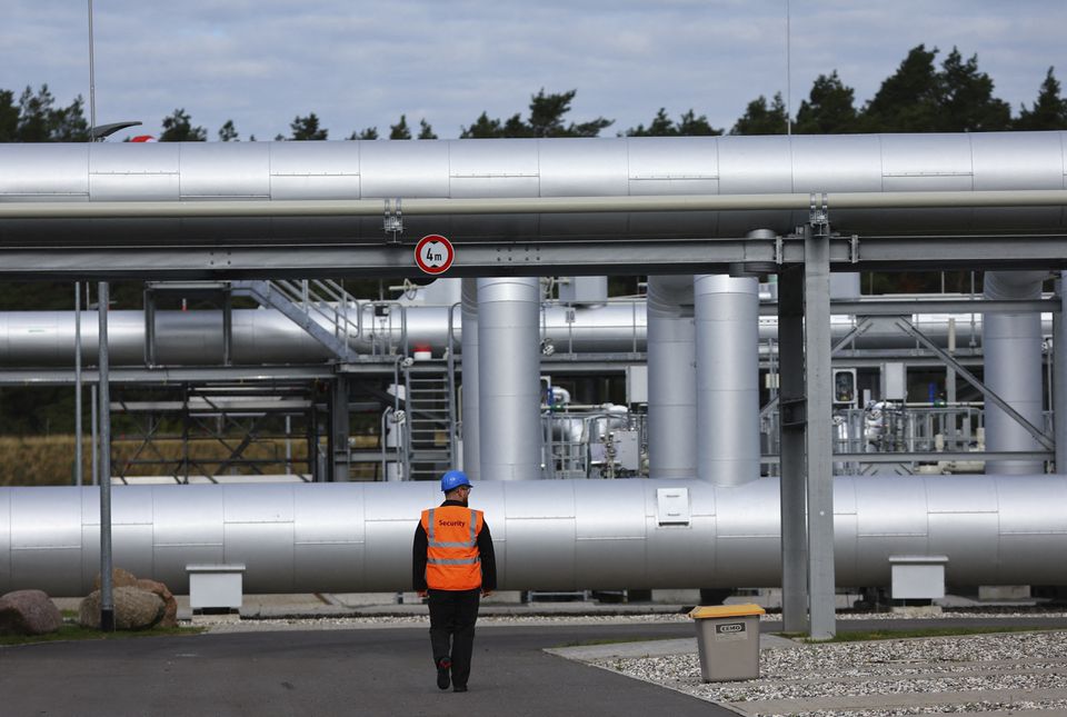 Security walks in front of the landfall facility of the Baltic Sea gas pipeline Nord Stream 2 in Lubmin, Germany, on September 19, 2022.  REUTERS/Fabrizio Bensch/File Photo