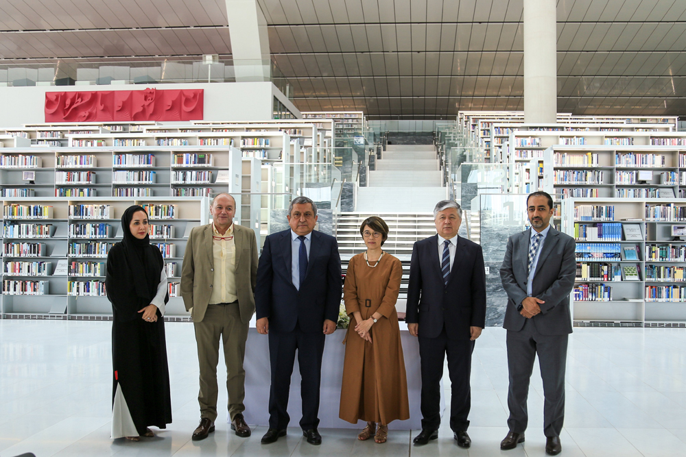 Ambassador of Uzbekistan to Qatar H E Dr. Bakhromjon Aloev, (second right) Shaazim Minovarov, Director of the Center of Islamic Civilization in Uzbekistan (third left) and Tan Huism, Executive Director of QNL (third right) with other officials during the ceremony.