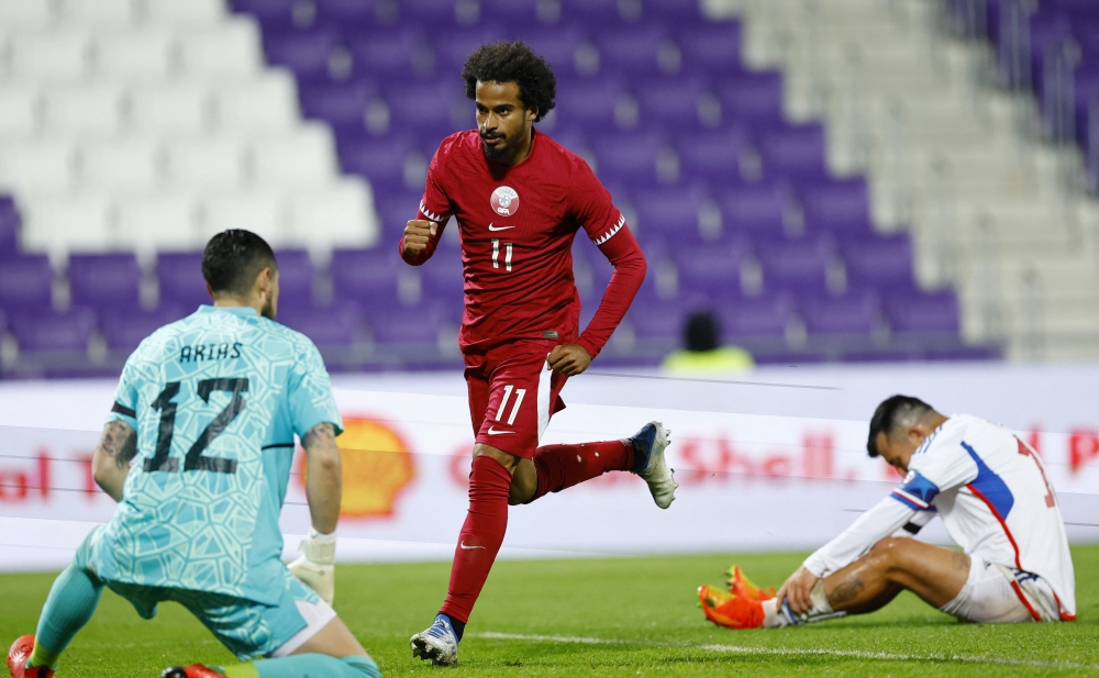 Akram Afif celebrates scoring Qatar's first goal against Chile during the International Friendly match at the Generali Arena, Vienna, Austria, on September 27, 2022.   REUTERS/Lisa Leutner
 