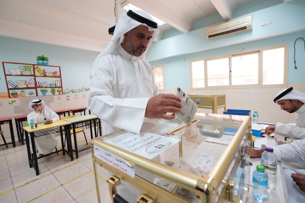 A man votes during parliamentary elections at a polling station in Kuwait City, Kuwait September 29, 2022. REUTERS/Stephanie McGehee