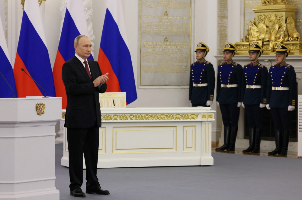 Russian President Vladimir Putin attends a ceremony to declare the annexation of the Russian-controlled territories of four Ukraine's Donetsk, Luhansk, Kherson and Zaporizhzhia regions, after holding what Russian authorities called referendums in the occupied areas of Ukraine that were condemned by Kyiv and governments worldwide, in the Georgievsky Hall of the Great Kremlin Palace in Moscow, Russia, on September 30, 2022. (Sputnik/Mikhail Metzel via REUTERS)