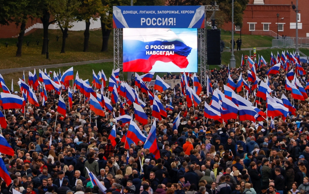 People attend a concert marking the declared annexation of the Russian-controlled territories of four Ukraine's Donetsk, Luhansk, Kherson and Zaporizhzhia regions, near Red Square in central Moscow, Russia, on September 30, 2022. (REUTERS)