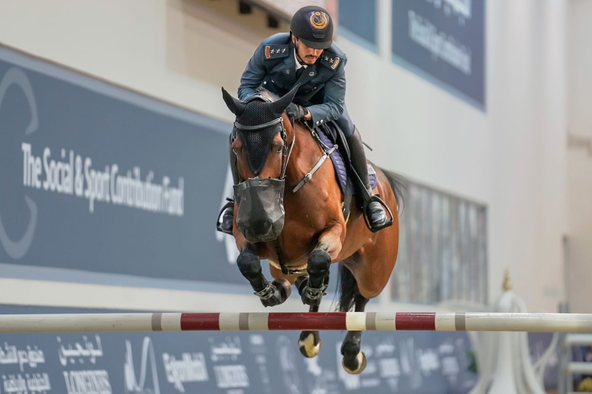 Faleh Suwead Al Ajami guides Steyburn over an obstacle.