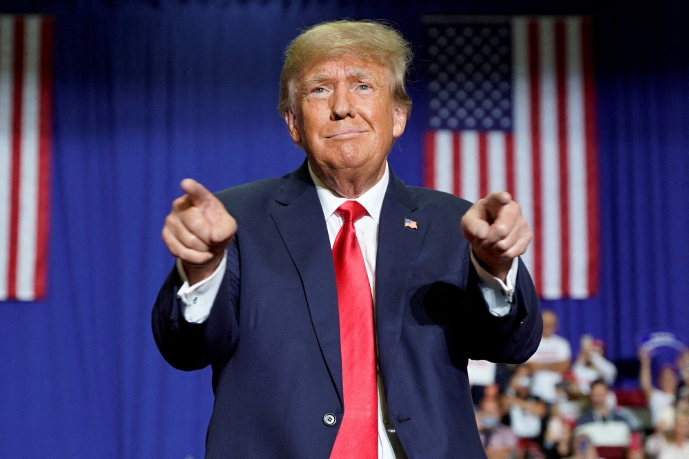 Former US President Donald Trump gestures during a rally in Warren, Michigan, on October 1, 2022. REUTERS/Chery Dieu-Nalio 