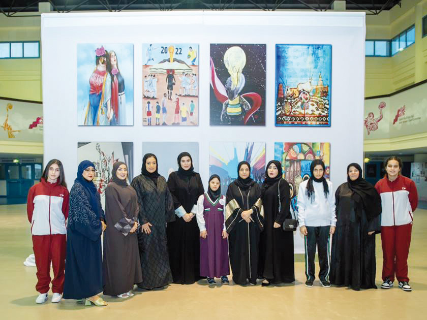 Minister of Social Development and Family H E Mariam bint Ali bin Nasser Al Misnad with Qatar Women’s Sports Committee members and artists of the mural.