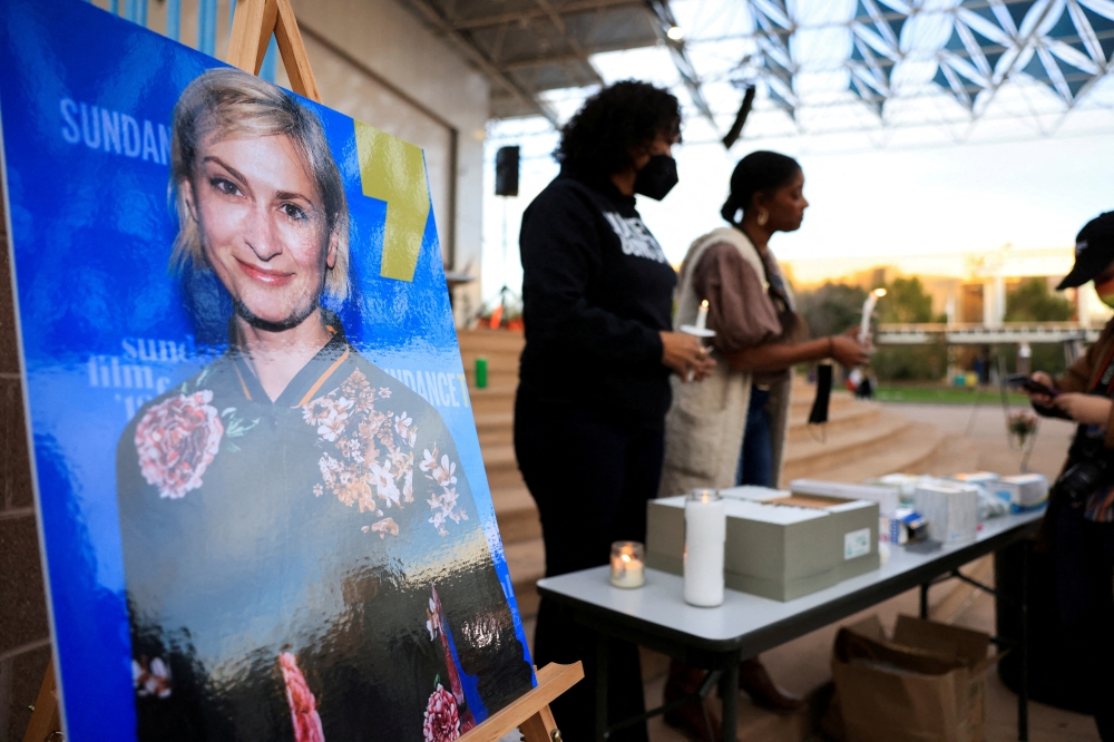 File Photo: An image of cinematographer Halyna Hutchins, who died after being shot by Alec Baldwin on the set of his movie 'Rust', is displayed at a vigil in her honour in Albuquerque, New Mexico, US, October 23, 2021. (REUTERS/Kevin Mohatt)