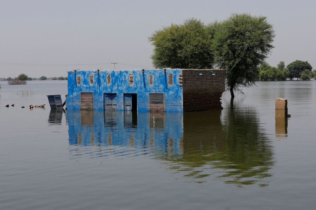 A view shows a submerged building amid flood water, following rains and floods during the monsoon season in Talti town in Sehwan, Pakistan September 15, 2022. REUTERS/Akhtar Soomro