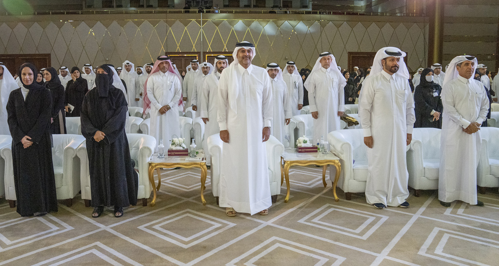 Prime Minister and Minister of Interior H E Sheikh Khalid bin Khalifa bin Abdulaziz Al Thani (centre), Minister of Education and Higher Education H E Buthaina bint Ali Al Jabr Al Nuaimi (first left) and other officials and teachers during a World Teachers' Day event in Doha yesterday. 