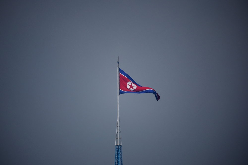 A North Korean flag flutters at the propaganda village of Gijungdong in North Korea, in this picture taken near the truce village of Panmunjom inside the demilitarized zone (DMZ) separating the two Koreas, on July 19, 2022. (REUTERS/Kim Hong-Ji)