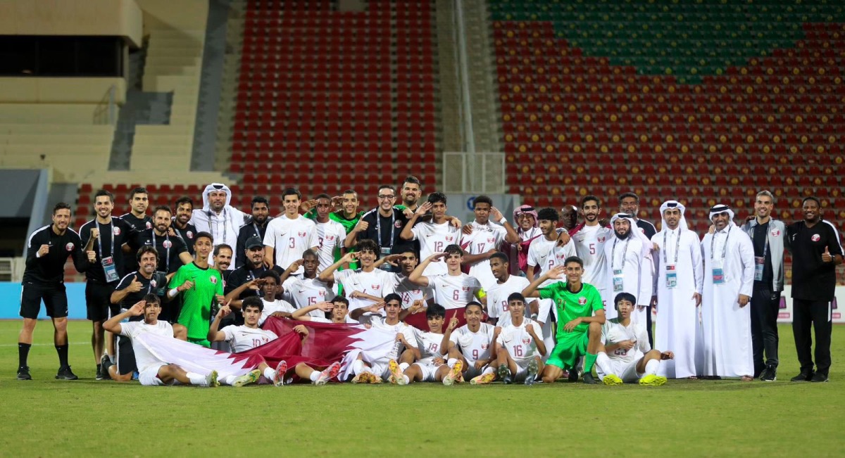 Qatar U17 players and team officials celebrate after qualifying for the AFC U17 Asian Cup on Sunday.