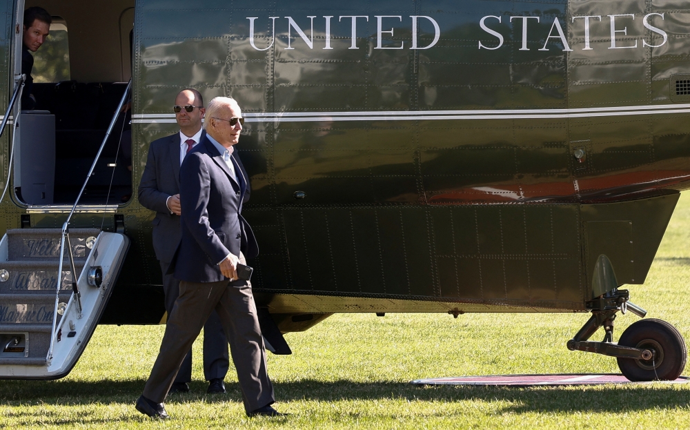 US President Joe Biden walks to the Oval Office after landing at the White House in Washington, US, on October 10, 2022. REUTERS/Evelyn Hockstein