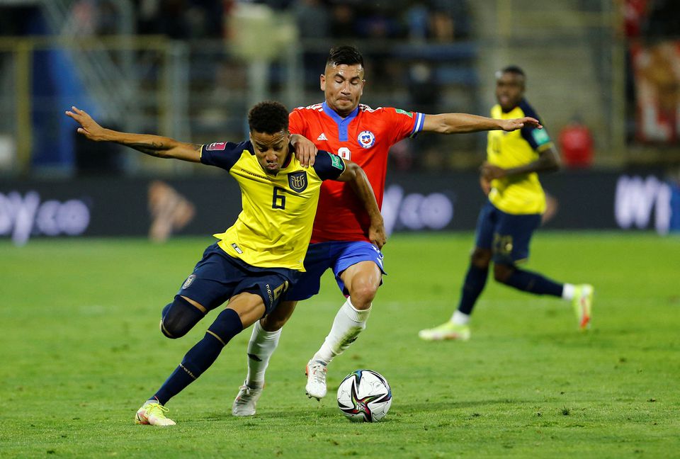 Ecuador's Byron Castillo in action against Chile's Jean Meneses  during their South American qualifiers for the 2022 FIFA World Cup at the Estadio San Carlos de Apoquindo, Santiago, Chile, on November 16, 2021.  File Photo / Reuters
