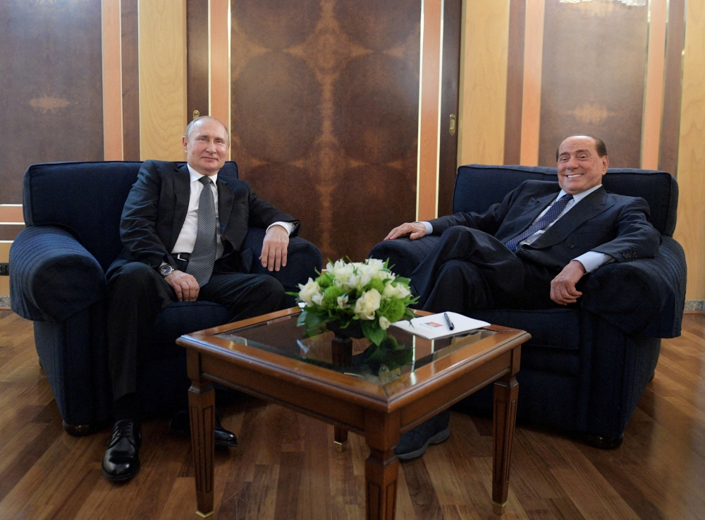 File Photo: Russian President Vladimir Putin meets with Silvio Berlusconi at an airport in Rome, Italy, July 4, 2019. (Sputnik/Alexey Druzhinin/Kremlin via REUTERS)