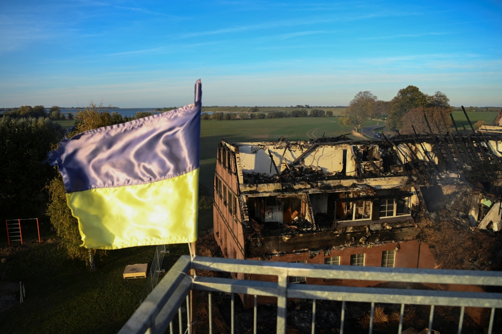 The remnants of a Red Cross home for Ukrainian refugees are seen following a fire in Gross Stroemkendorf near Wismar, Germany, October 20, 2022. (REUTERS/Annegret Hilse)