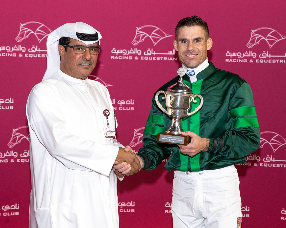 QREC Racing Manager Abdulla Rashid Al Kubaisi after handing over the trophy to jockey Tomas Lukasek. PIC Juhaim/QREC 