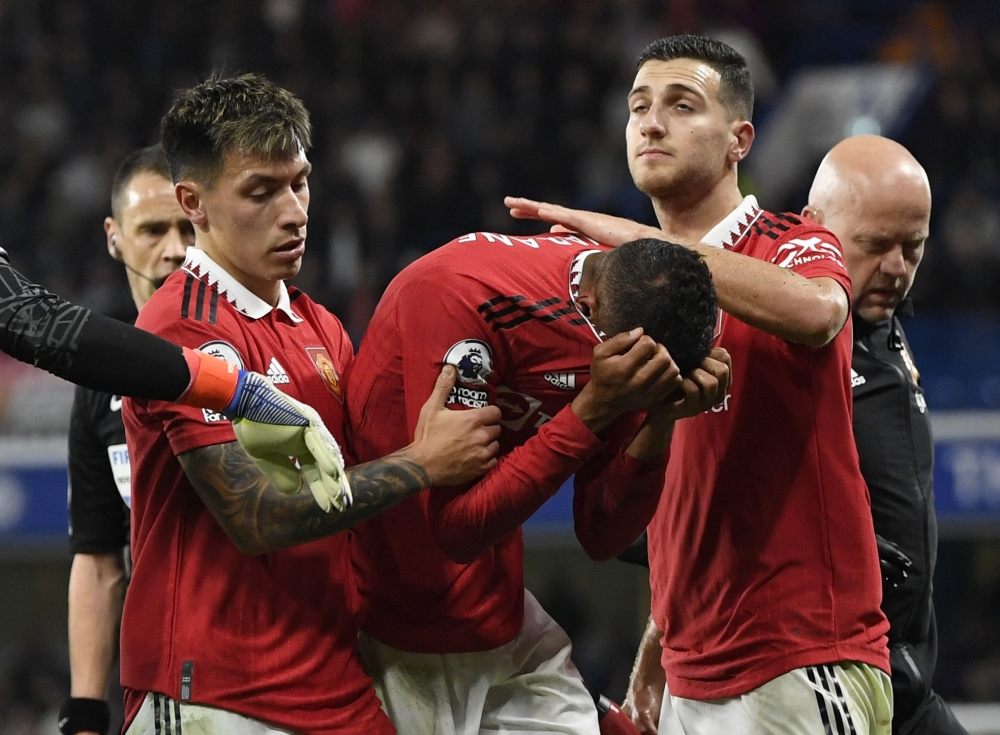 Manchester United's Raphael Varane walks off the pitch after sustaining an injury during the match against Chelsea at Stamford Bridge in London on October 22, 2022. REUTERS/Tony Obrien