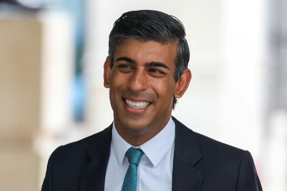 FILE PHOTO: Conservative leadership candidate Rishi Sunak arrives at Broadcasting House ahead of his appearance on BBC's Sunday with Laura Kuenssberg show in London, Britain September 4, 2022. REUTERS/Phil Noble/File Photo