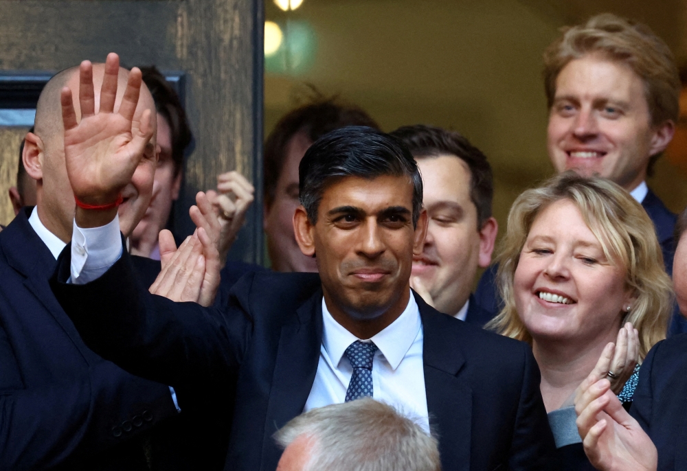 New leader of the Britain's Conservative Party Rishi Sunak walks outside the Conservative Campaign Headquarters, in London, Britain, on October 24, 2022. REUTERS/Hannah McKay