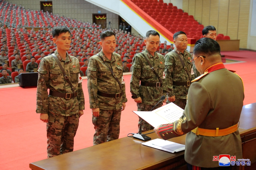 Korean People's Army medics receive awards for their contributions in fighting the Covid-19 pandemic in Pyongyang, North Korea, August 18, 2022. (Korean Central News Agency via REUTERS)