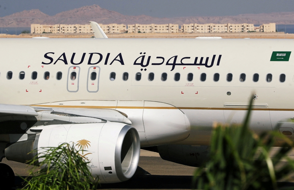 Saudi Arabian Airlines plane, is seen at the airport of the Red Sea resort of Sharm el-Sheikh, Egypt, on August 9, 2021. Picture taken through a window. File Photo / Reuters