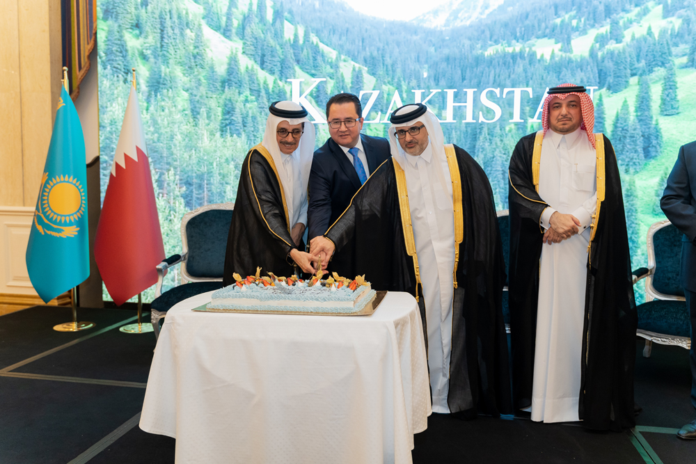 Minister of State, and President of Qatar National Library, H E Dr. Hamad bin Abdulaziz Al Kawari (left), Kazakhstan's  Ambassador to Qatar H E Arman Issagaliyev (second left), Minister of Municipality, H E Dr. Abdullah bin Abdulaziz bin Turki Al Subaie (second right), and Director of Protocol Department, Ministry of Foreign Affairs H E Ibrahim Fakhroo (right) during the cake cutting ceremony to mark Kazakhstan's National Day held at The Ritz-Carlton, Doha. 