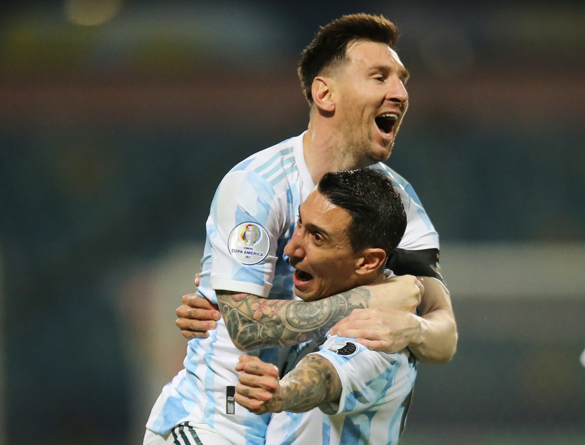 Argentina’s Angel Di Maria with Lionel Messi.