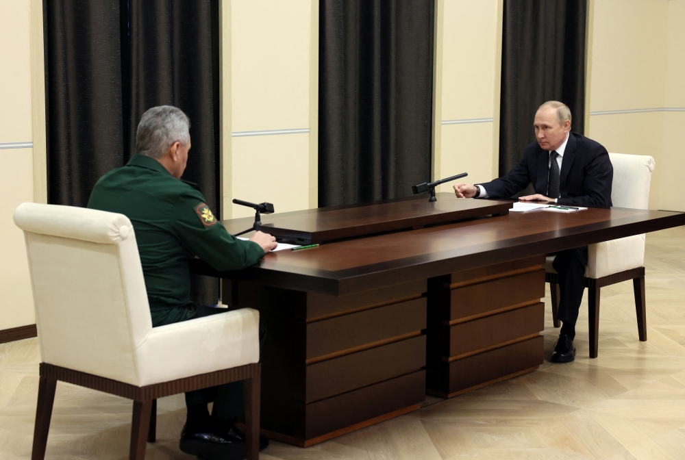 Russian President Vladimir Putin attends a meeting with Defence Minister Sergei Shoigu at the Novo-Ogaryovo state residence, outside Moscow, Russia, on October 28, 2022. Sputnik/Mikhail Metzel/Handout via REUTERS 