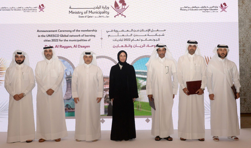 Minister of Municipality H E Dr. Abdullah bin Abdulaziz bin Turki Al Subaie (third left), Minister of Education and Higher Education H E Buthaina bint Ali Al Jabr Al Nuaimi (centre) and officials during the ceremony to celebrate joining of three cities to Unesco's GNLC, in Doha, yesterday. 