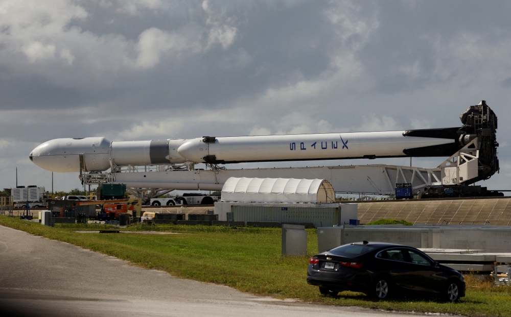 A SpaceX Falcon Heavy rocket with a long-delayed national security payload for the U.S. Space Force, rolls to launch pad 39A at NASA's Kennedy Space Center in Cape Canaveral, Florida, US, on October 31, 2022. Launch is scheduled for November 1. REUTERS/Joe Skipper