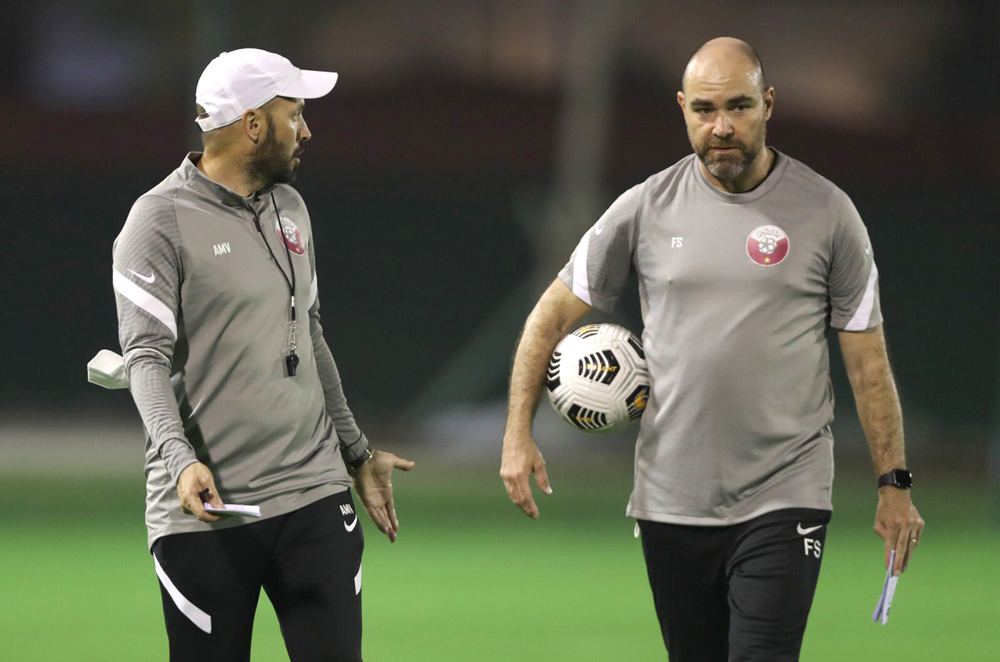 Qatar coach Felix Sanchez with an assistant. 