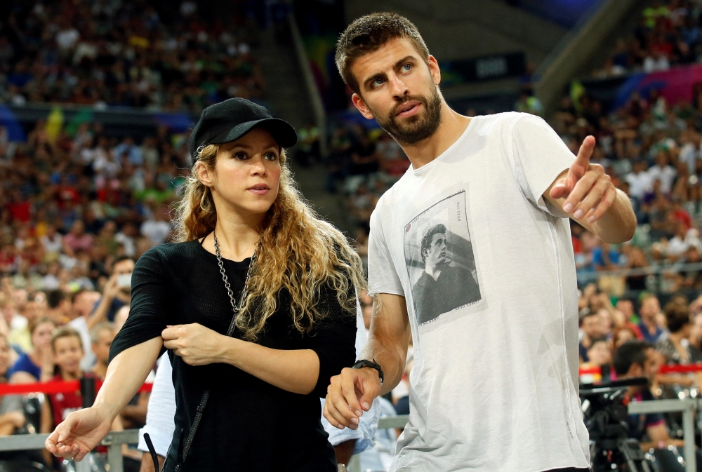 File photo: Colombian singer Shakira (L) and her partner, Barcelona soccer player Gerard Pique, attend the Basketball World Cup quarter-final game between the U.S. and Slovenia in Barcelona September 9, 2014. Reuters/Albert Gea/File Photo
 