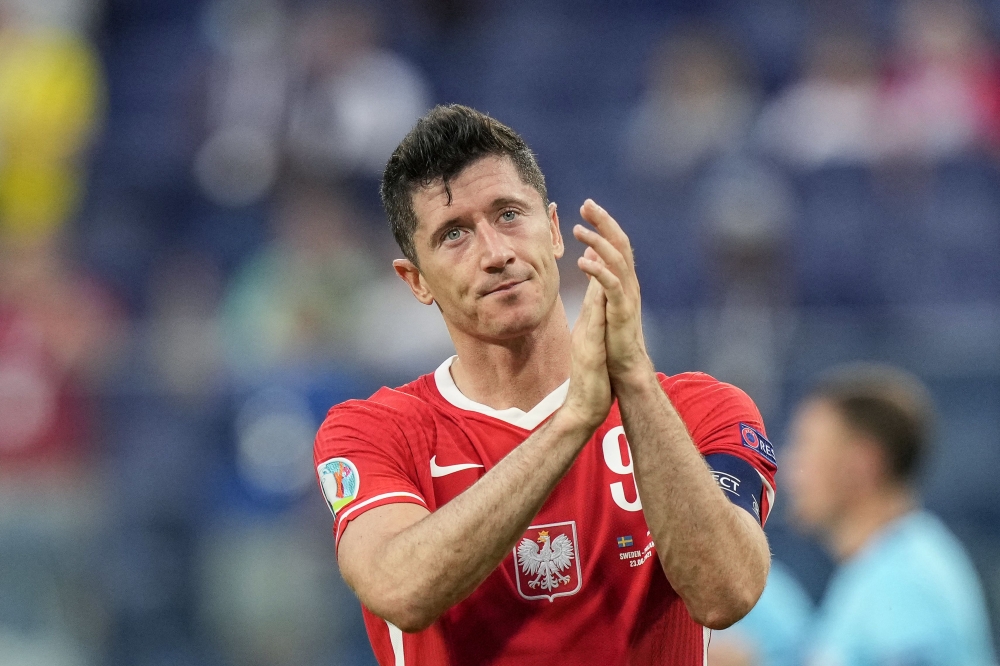 In this file photo taken on June 23, 2021 Poland's forward Robert Lewandowski reacts after losing the UEFA EURO 2020 Group E football match between Sweden and Poland at Saint Petersburg Stadium in Saint Petersburg. (Photo by Dmitry LOVETSKY / POOL / AFP)
 