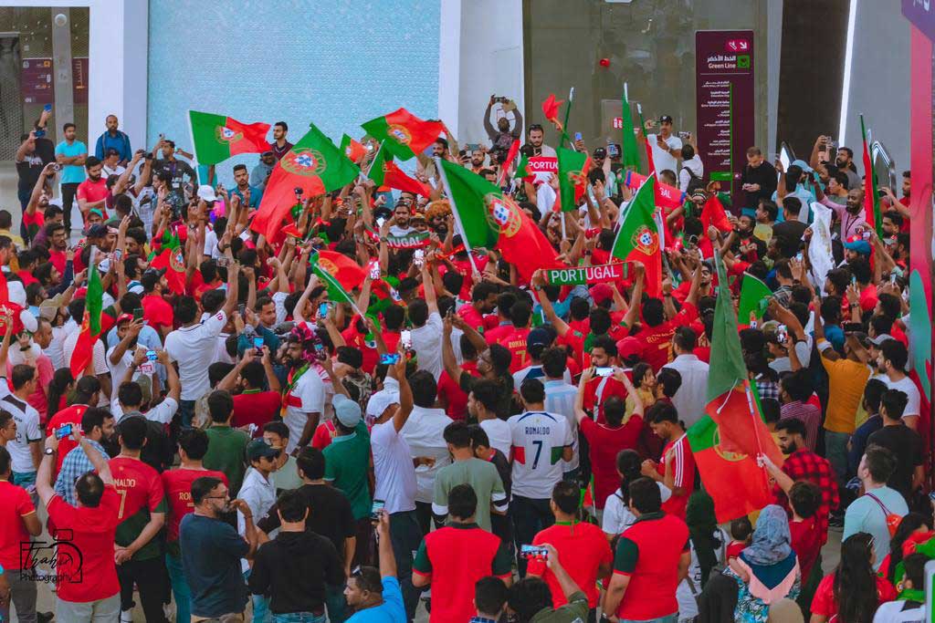 Portugal fans celebrate during a parade in Doha. 