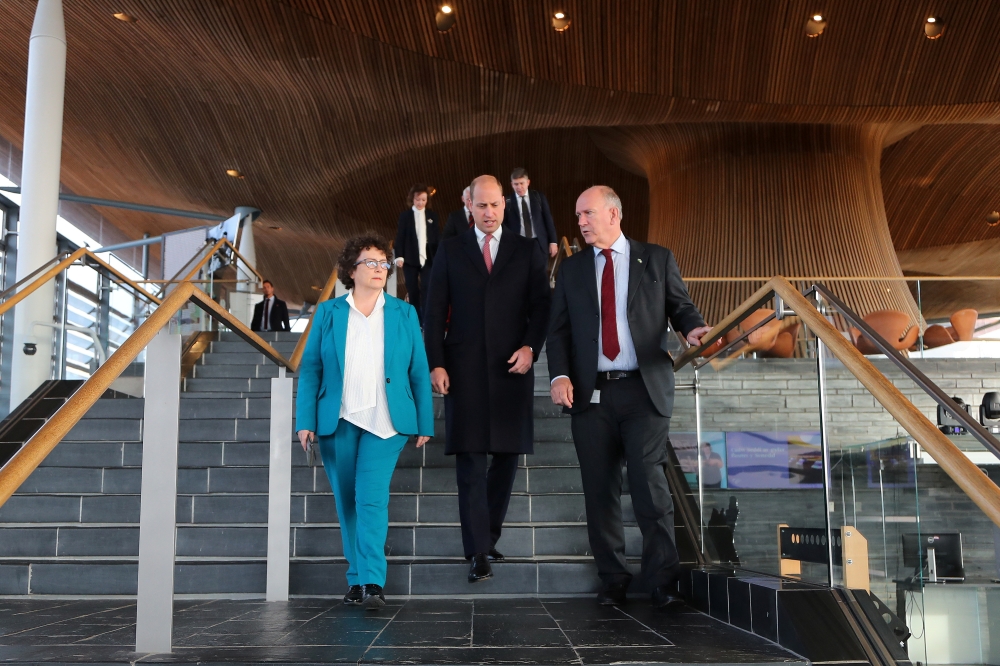 Britain's Prince William, Prince of Wales, walks with Senedd members Elin Jones (left) and David Rees during a visit to the Senedd, the Welsh Parliament, in Cardiff, Wales, Britain on November 16, 2022. Geoff Caddick/Pool via REUTERS