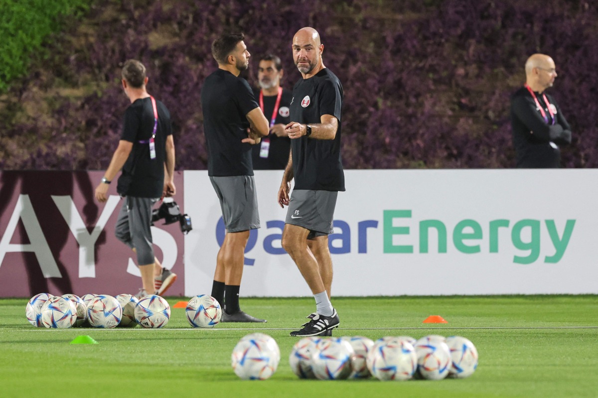 Qatar coach Felix Sanchez leads a training session in Doha, yesterday.