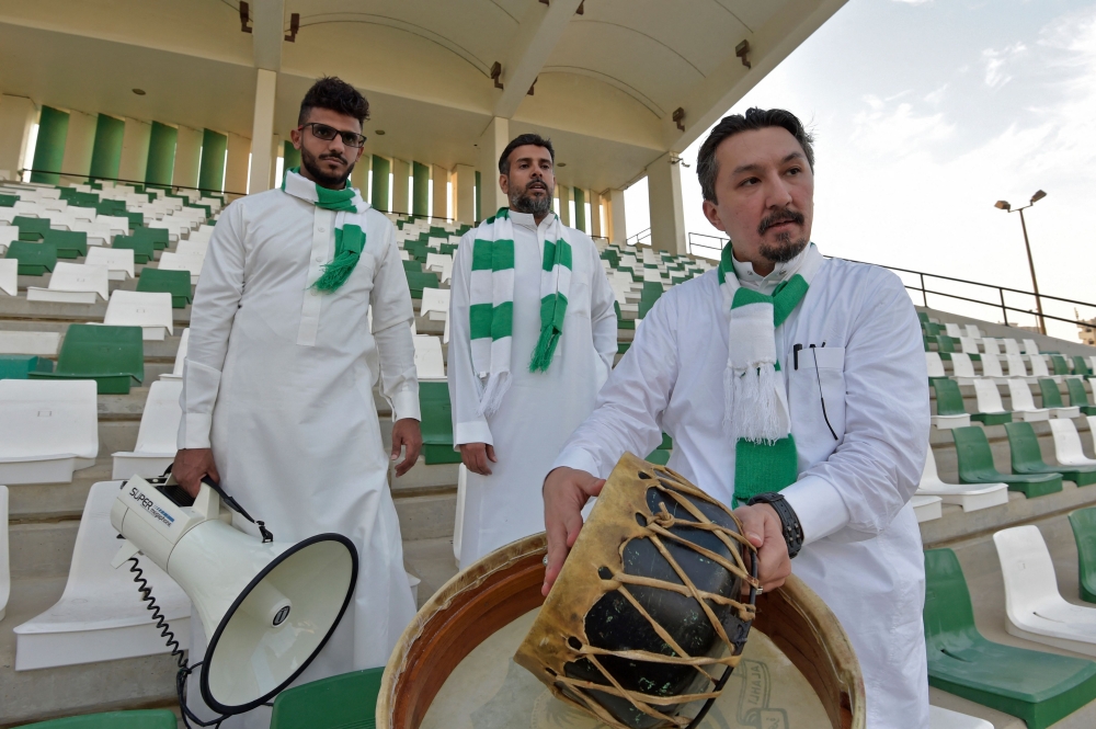 Saudi national football team fan and the head of the fan association for the prestigious Jeddah-based Saudi club Al-Ahly, Bader Turkistani, poses for a picture on November 9, 2022 in the Saudi Red Sea city of Jeddah. Photo by Amer Hilabi / AFP