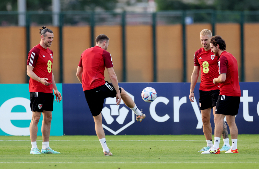 Wales’ Gareth Bale, Joe Allen and Aaron Ramsey during a training session at Al Sadd SC, yesterday. REUTERS