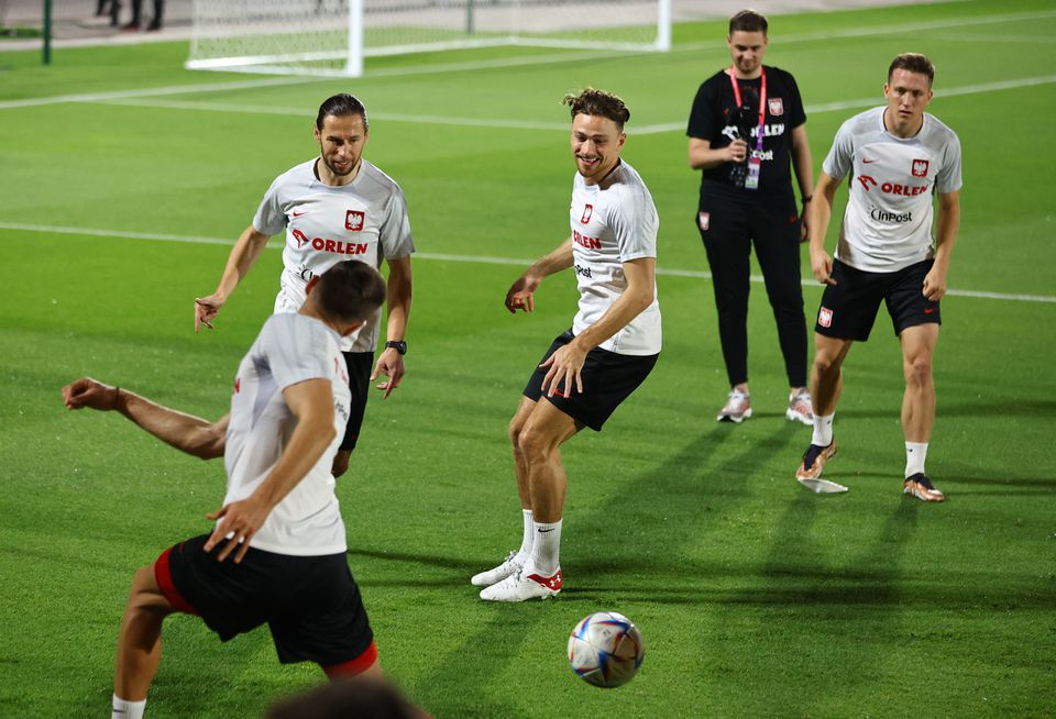 Poland's Grzegorz Krychowiak and Matty Cash in action during their FIFA World Cup Qatar 2022 training at Al Kharaitiyat SC Training Facilities in Umm Salal, Qatar, on November 18, 2022.  REUTERS/Ibraheem Al Omari
