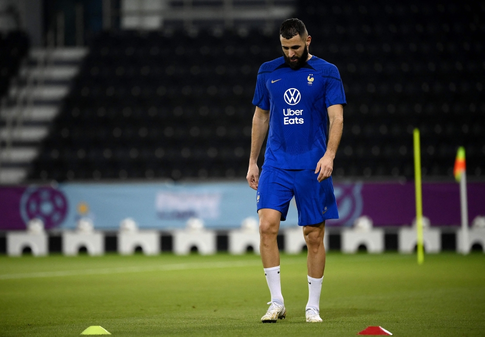 In this file photo taken on November 17, 2022, France's forward Karim Benzema looks down during a training session at the Jassim-bin-Hamad Stadium in Doha, ahead of the Qatar 2022 World Cup football tournament. Photo by FRANCK FIFE / AFP