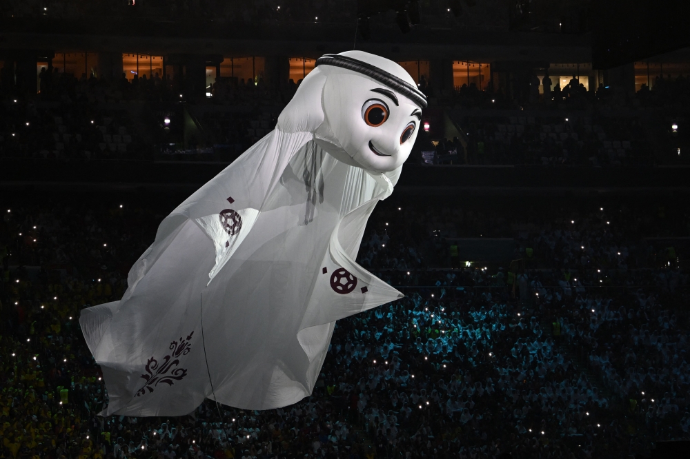 The Qatar 2022 mascot La'eeb performs during the opening ceremony ahead of the Qatar 2022 World Cup Group A football match between Qatar and Ecuador at the Al-Bayt Stadium in Al Khor, north of Doha on November 20, 2022. (Photo by MANAN VATSYAYANA / AFP)