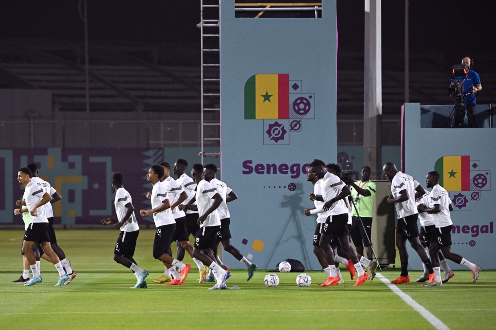 Senegal's players take part in a training session at the Duhail SC training facilities in Doha on November 20, 2022, on the eve of the Qatar 2022 World Cup football tournament Group A match between Senegal and the Netherlands. (AFP/Ozan Kose)