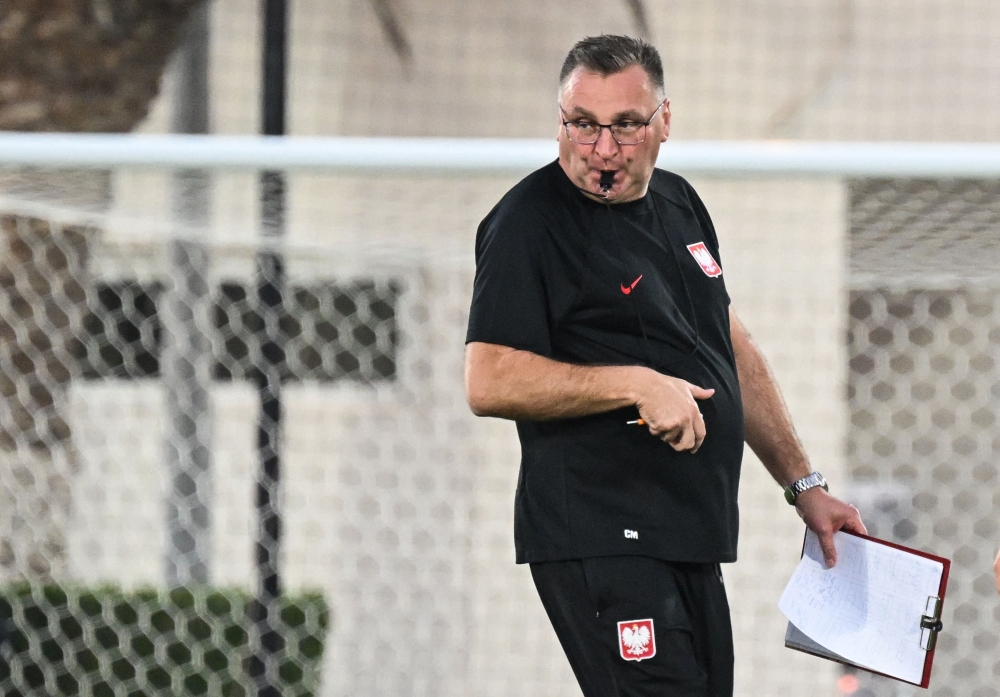 Poland's coach Czeslaw Michniewicz leads a training session at the Al Kharaititat SC Training Site in Doha on November 21, 2022, on the eve of the Qatar 2022 World Cup football match between Mexico and Poland. (Photo by ANDREJ ISAKOVIC / AFP)