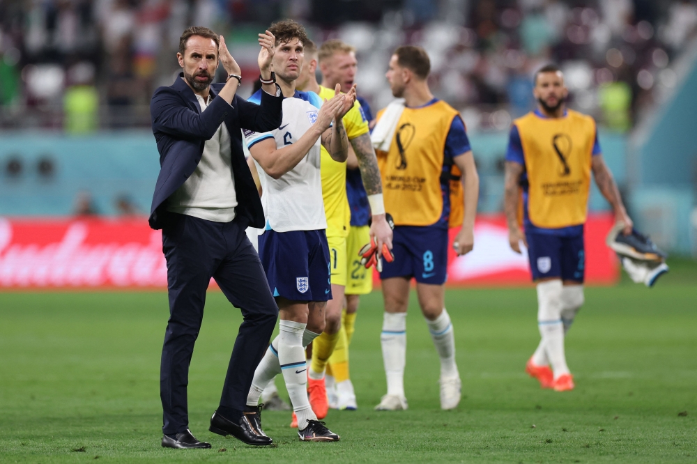 England's coach Gareth Southgate applauds supporters after the Qatar 2022 World Cup Group B football match between England and Iran at the Khalifa International Stadium in Doha on November 21, 2022. (Photo by Giuseppe CACACE / AFP)