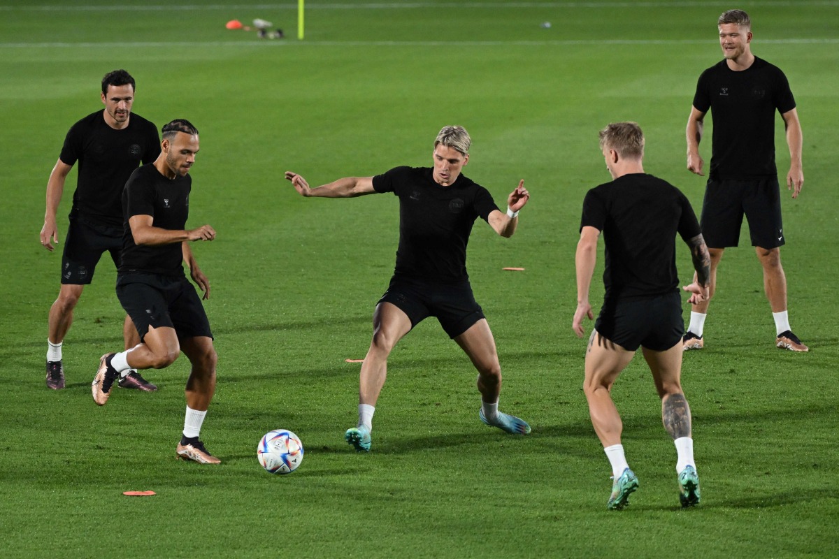 From left: Denmark’s midfielder Thomas Delaney, forward Martin Braithwaite, defender Jens Stryger Larsen, defender Daniel Wass and forward Andreas Cornelius take part in a training session at the Al Sailiya SC Training Site in Doha,  yesterday. AFP