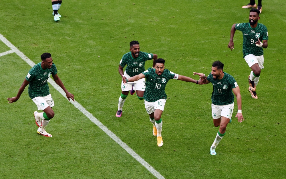 Saudi Arabia's Salem Al-Dawsari celebrates scoring their second goal with teammates REUTERS/Marko Djurica