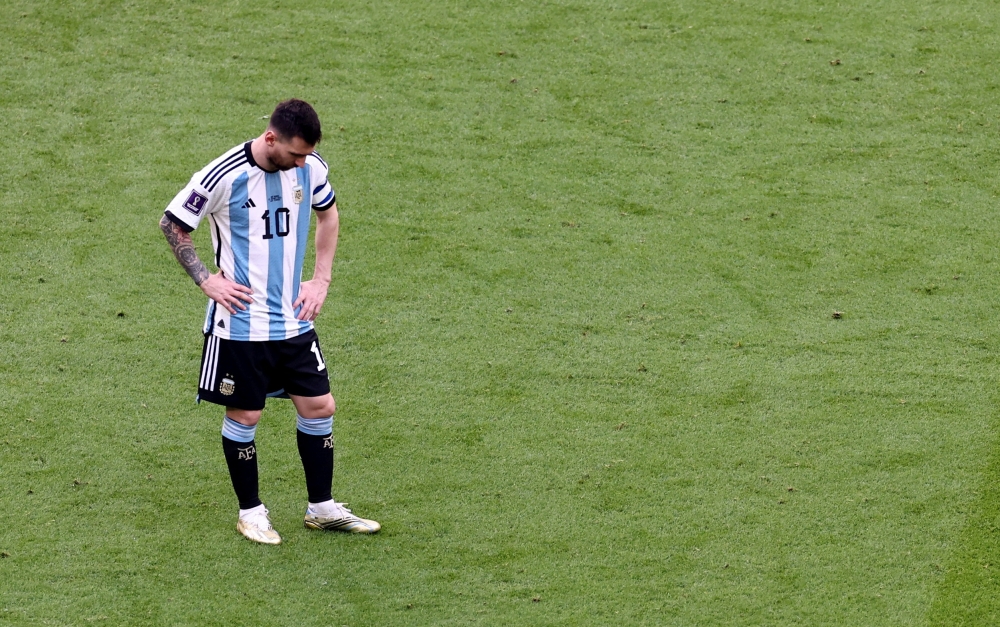 Argentina's Lionel Messi reacts after Saudi Arabia's Saleh Al-Shehri scores their first goal during the FIFA World Cup Qatar 2022 Group C match at the Lusail Stadium, Lusail, Qatar, on November 22, 2022. REUTERS/Marko Djurica