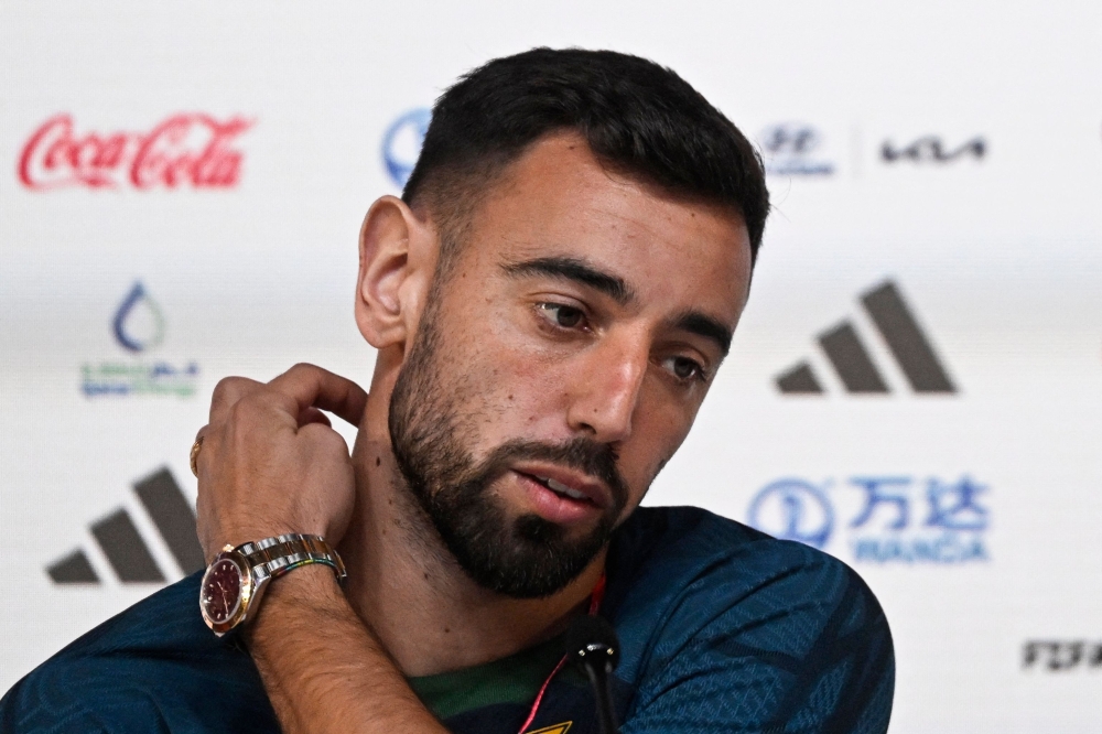 Portugal's midfielder Bruno Fernandes holds a press conference at the Qatar National Convention Center (QNCC) in Doha on November 23, 2022, on the eve of the Qatar 2022 World Cup football match between Portugal and Ghana. (Photo by PATRICIA DE MELO MOREIRA / AFP)