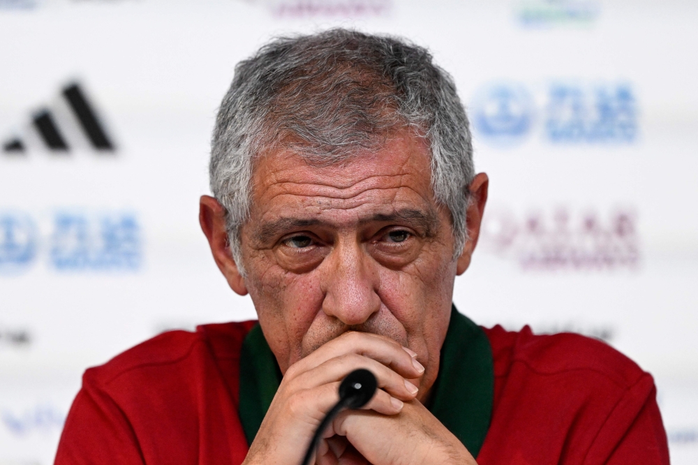 Portugal's coach #00 Fernando Santos attends a press conference at the Qatar National Convention Center (QNCC) in Doha on November 23, 2022, on the eve of the Qatar 2022 World Cup football match between Portugal and Ghana. (Photo by PATRICIA DE MELO MOREIRA / AFP)