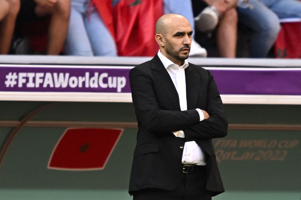 Morocco's coach Walid Regragui watches his players from the touchline during the Qatar 2022 World Cup Group F football match between Morocco and Croatia at the Al-Bayt Stadium in Al Khor, north of Doha on November 23, 2022. (Photo by MANAN VATSYAYANA / AFP)